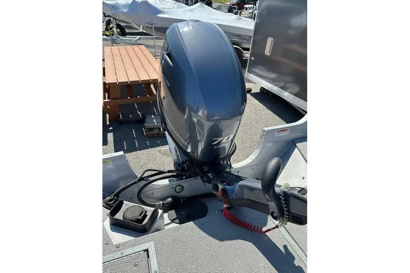 Slide: The Image of 2021 Starcraft Delta 168 Tiller with Yamaha F70LA outboard motor, parked on trailer. - 25