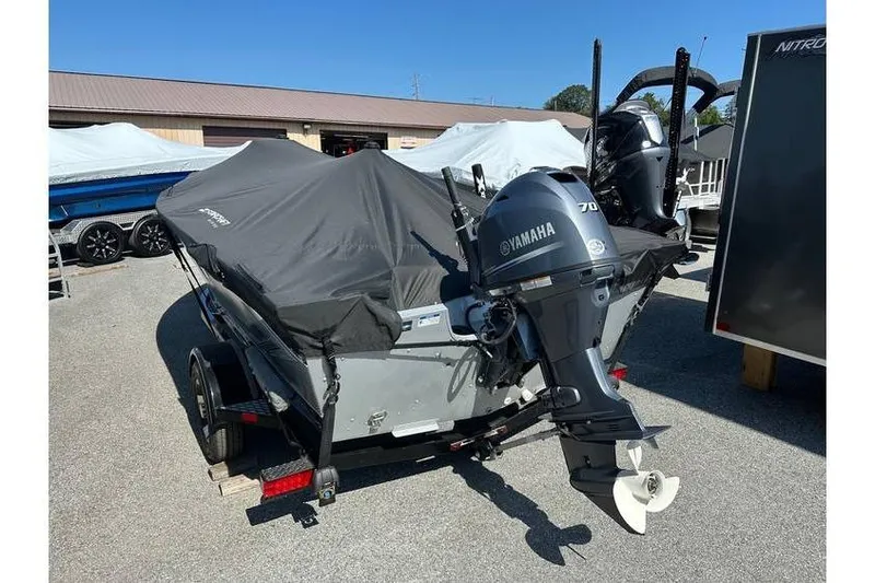Slide: The Image of 2021 Starcraft Delta 168 Tiller boat with Yamaha F70LA engine on trailer, covered and parked. - 3