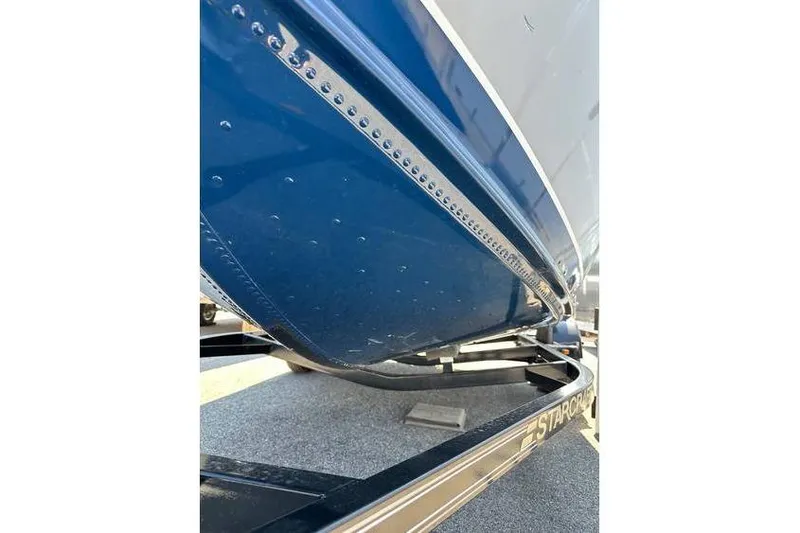 Slide: The Image of 2021 Starcraft Delta 168 Tiller boat on trailer, featuring Yamaha F70LA engine. - 30