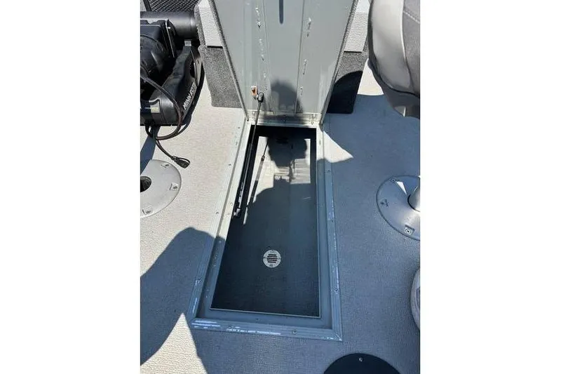 Slide: The Image of 2021 Starcraft Delta 168 Tiller boat interior storage compartment with Yamaha F70LA engine. - 4
