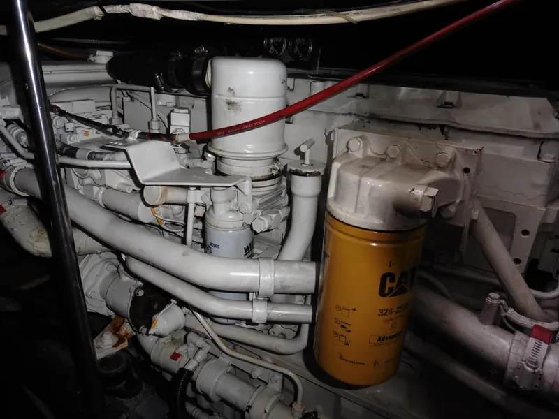 Slide: The Image of Engine compartment of a 1997 Sea Ray 440 Express Bridge, featuring various mechanical components. - 24