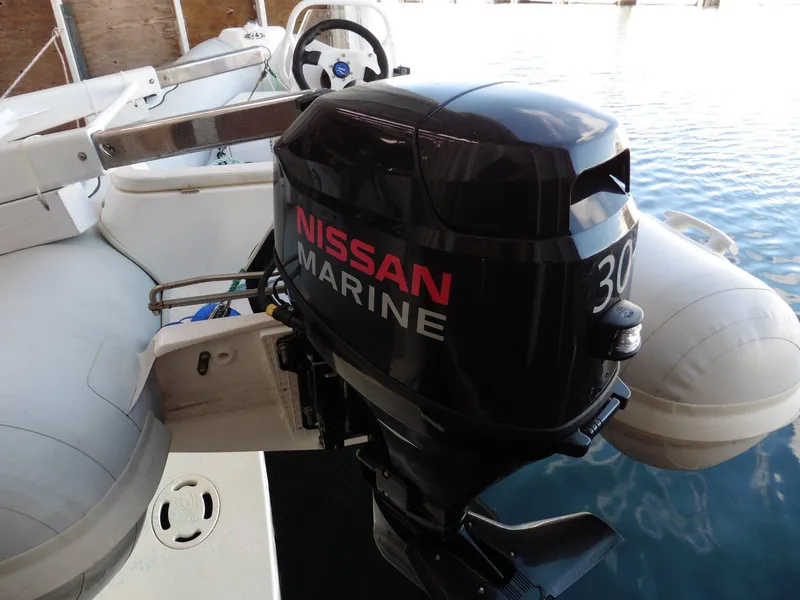 Slide: The Image of Nissan Marine outboard motor on a 1997 Sea Ray 440 Express Bridge boat. - 29