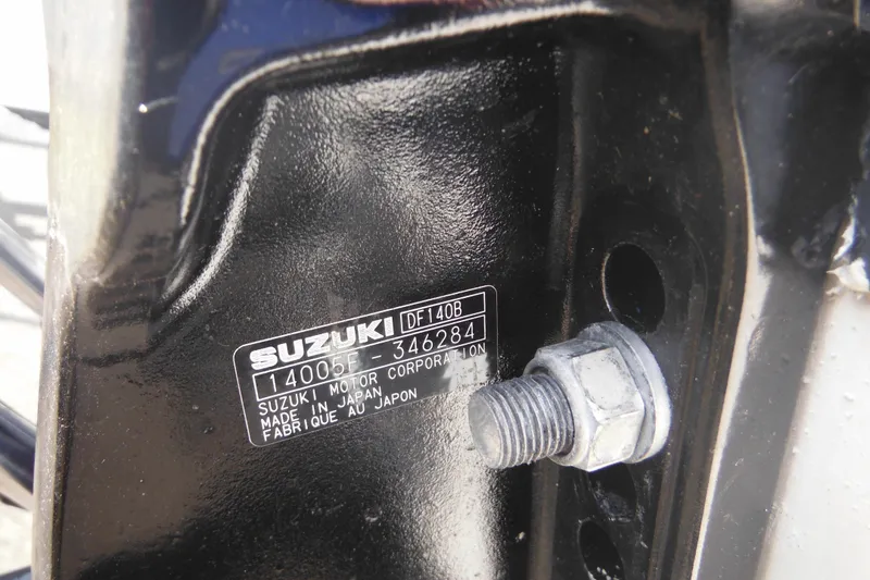 Slide: The Image of Close-up of Suzuki DF140B engine label on a 1998 Boston Whaler 20 Ventura Bowrider. - 10