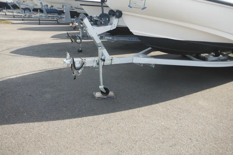 Slide: The Image of Trailer for 1998 Boston Whaler 20 Ventura Bowrider on pavement. - 2