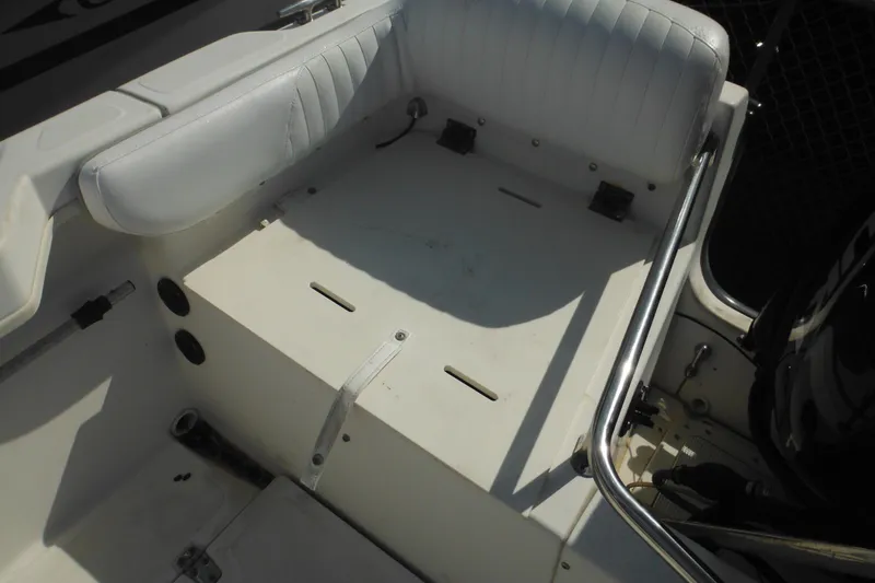 Slide: The Image of 1998 Boston Whaler 20 Ventura Bowrider interior seating and storage area. - 21