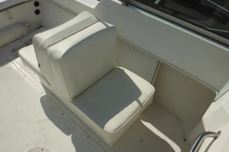 Slide: The Image of 1998 Boston Whaler 20 Ventura Bowrider interior seating, white upholstery, spacious layout. - 23