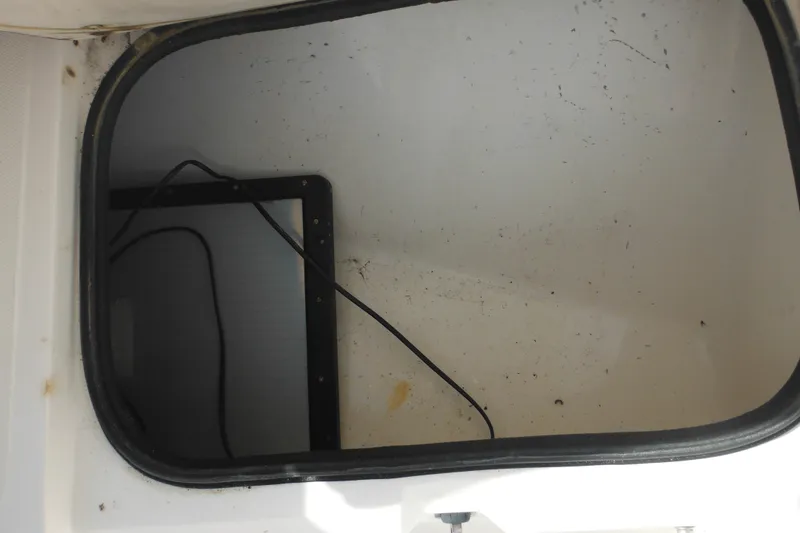 Slide: The Image of Storage compartment of a 1998 Boston Whaler 20 Ventura Bowrider boat. - 29