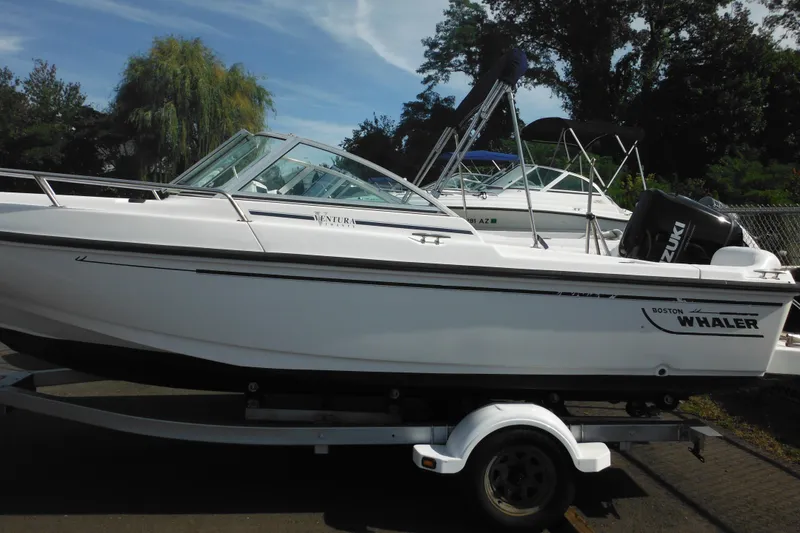 Slide: The Image of 1998 Boston Whaler 20 Ventura Bowrider on trailer, parked outdoors. - 3