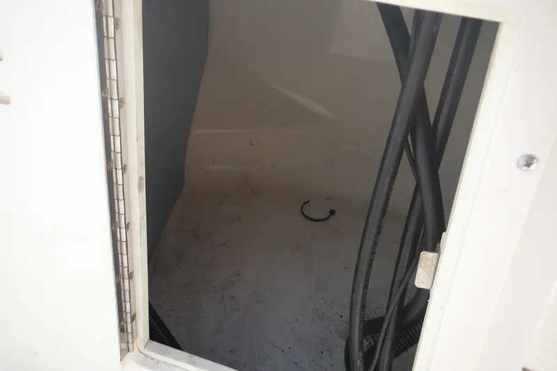 Slide: The Image of Interior compartment of a 1998 Boston Whaler 20 Ventura Bowrider boat. - 32