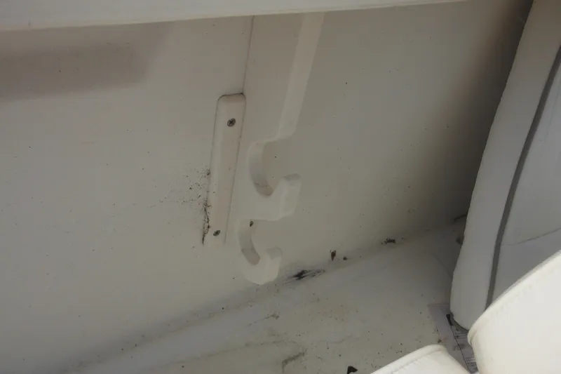 Slide: The Image of Interior detail of a 1998 Boston Whaler 20 Ventura Bowrider, showing hooks and seating area. - 37