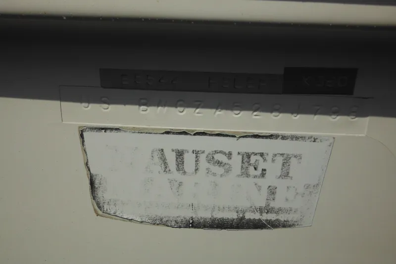Slide: The Image of 1998 Boston Whaler 20 Ventura Bowrider hull identification number and faded label. - 8