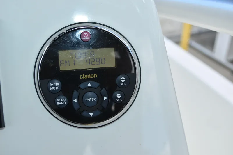 Slide: The Image of Clarion radio control panel on 2010 Boston Whaler 230 Dauntless boat. - 11