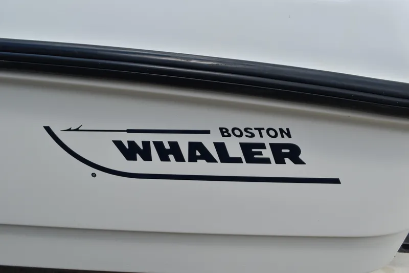 Slide: The Image of Boston Whaler 230 Dauntless 2010 logo on boat hull. - 2
