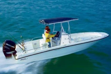 Slide: The Image of 2010 Boston Whaler 230 Dauntless boat cruising on open water. - 43