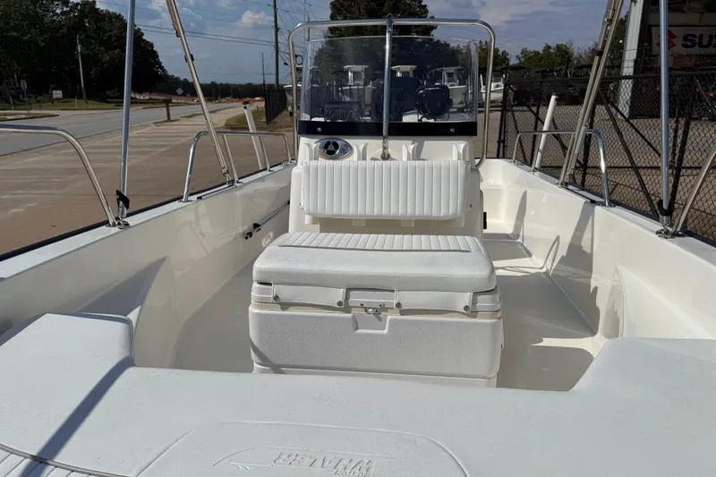 Slide: The Image of 2005 Boston Whaler 170 Montauk boat interior with seating and steering console. - 13