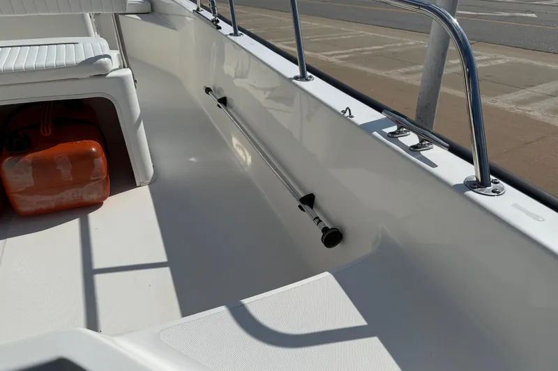 Slide: The Image of 2005 Boston Whaler 170 Montauk interior with seating and safety equipment. - 23