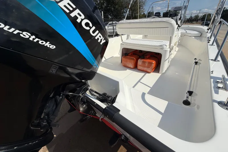 Slide: The Image of 2005 Boston Whaler 170 Montauk boat with Mercury FourStroke engine and storage compartments. - 24