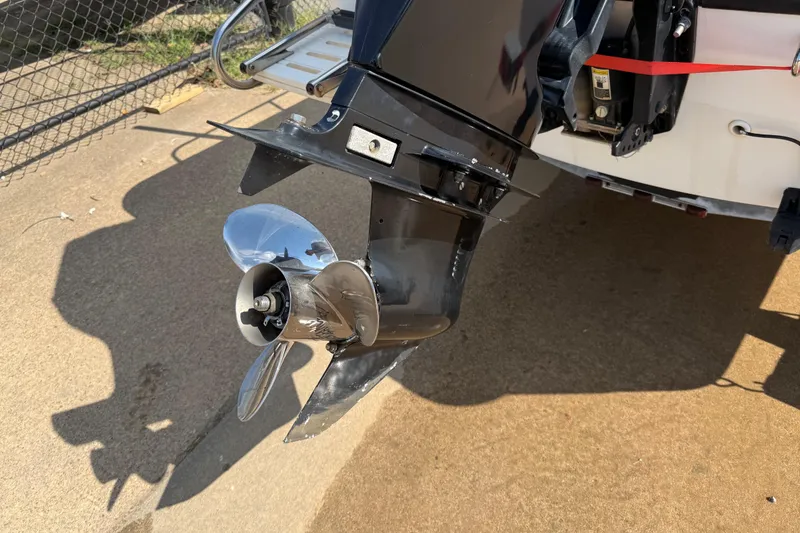 Slide: The Image of Outboard motor of a 2005 Boston Whaler 170 Montauk boat, showing propeller detail. - 27