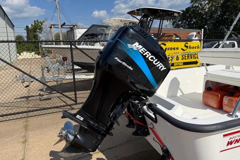 Slide: The Image of 2005 Boston Whaler 170 Montauk with Mercury FourStroke engine at a service yard. - 7