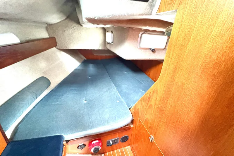 Slide: The Image of Cozy cabin interior of 1985 Beneteau First 345 sailboat with wooden finish. - 17