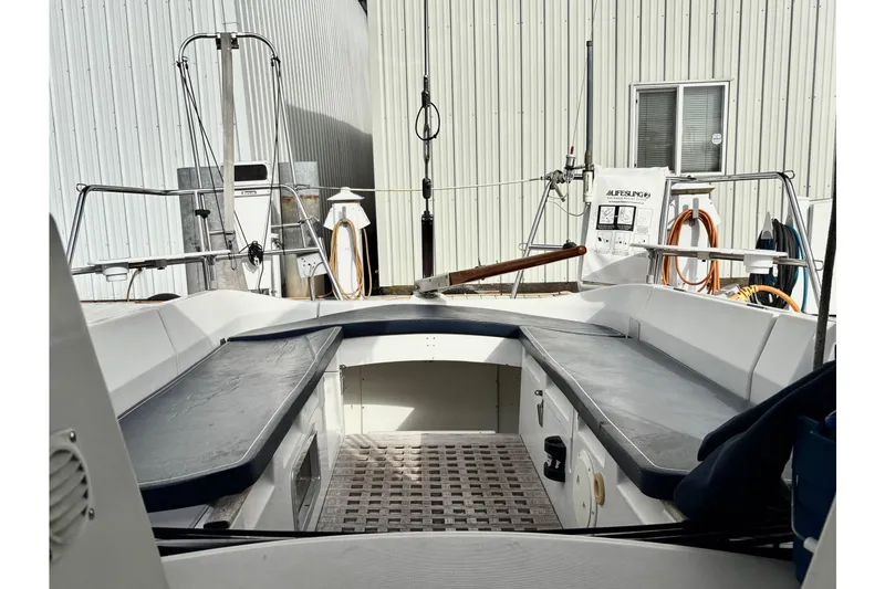 Slide: The Image of Cockpit of 1985 Beneteau First 345 sailboat, featuring seating and nautical equipment. - 5