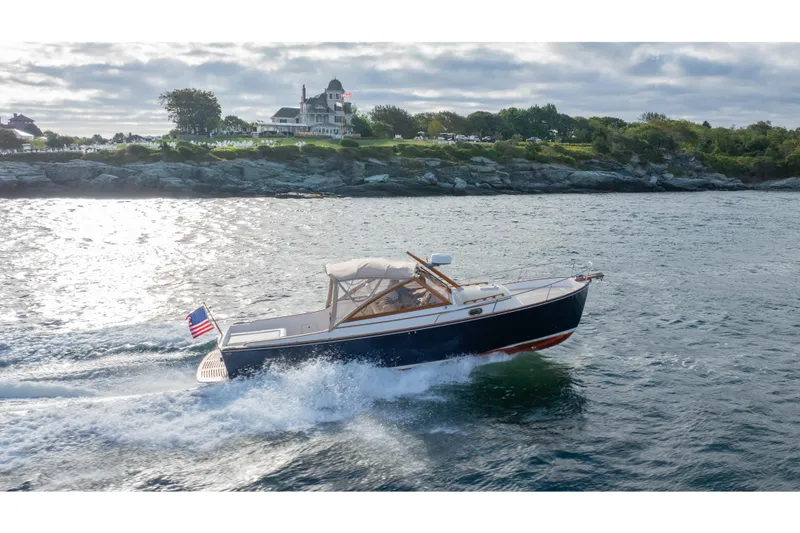 Slide: The Image of 2020 CH Marine Shelter Island Nomad cruising near scenic coastline. - 22