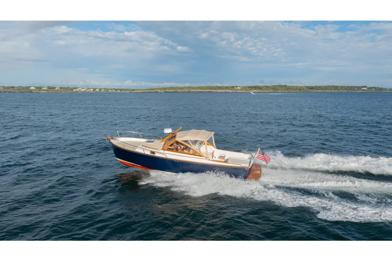 Slide: The Image of 2020 CH Marine Shelter Island Nomad cruising on open water under a clear sky. - 28
