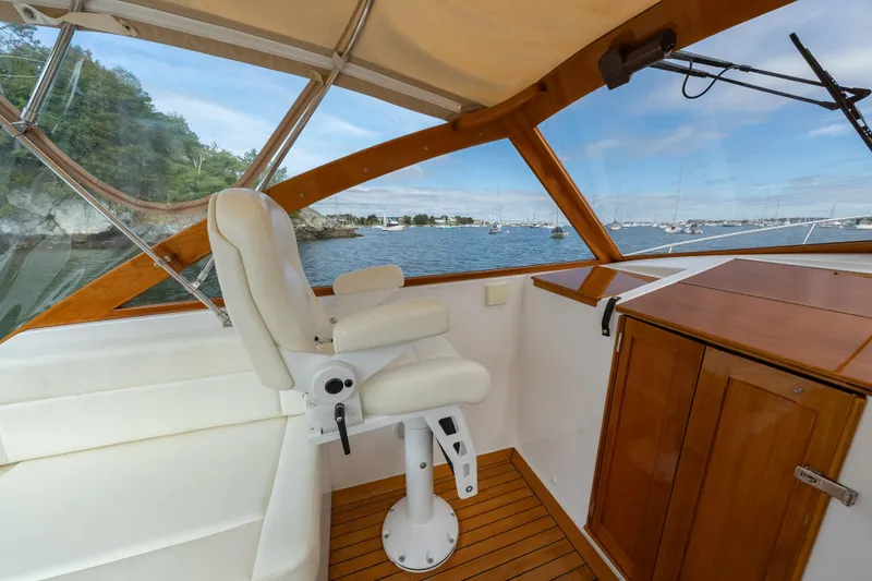 Slide: The Image of Interior view of 2020 CH Marine Shelter Island Nomad boat with scenic ocean backdrop. - 8