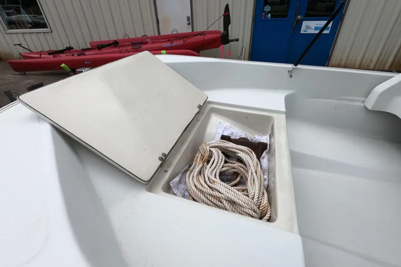 Slide: The Image of Open storage compartment on 1992 Boston Whaler 13 GLS boat with rope inside. - 7