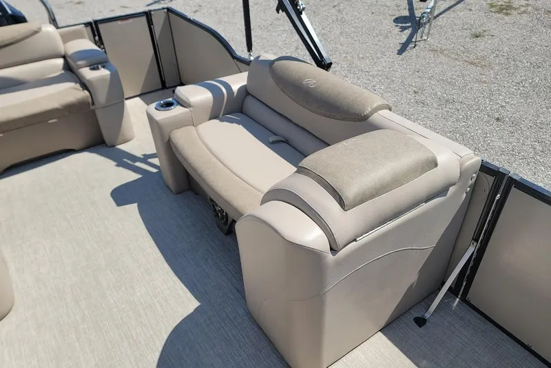 Slide: The Image of 2020 Avalon Catalina Elite 23' boat interior with beige seating and cup holder. - 15