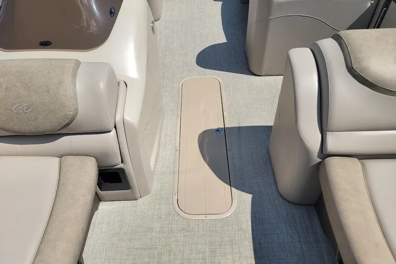 Slide: The Image of 2020 Avalon Catalina Elite 23' boat interior with beige seating and flooring. - 16
