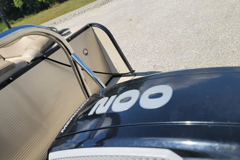 Slide: The Image of 2020 Avalon Catalina Elite 23' boat with Mercury engine, parked on a sunny day. - 22