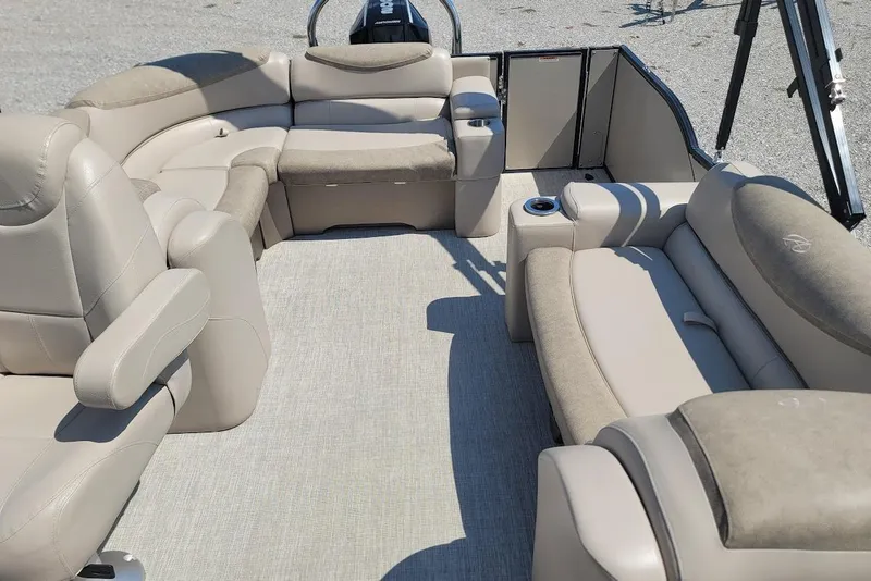 Slide: The Image of 2020 Avalon Catalina Elite 23' boat interior with beige seating and spacious layout. - 9