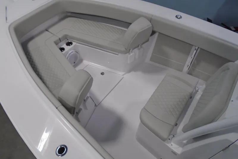 Slide: The Image of 2026 Jupiter 26 boat interior with cushioned seating and modern design. - 24