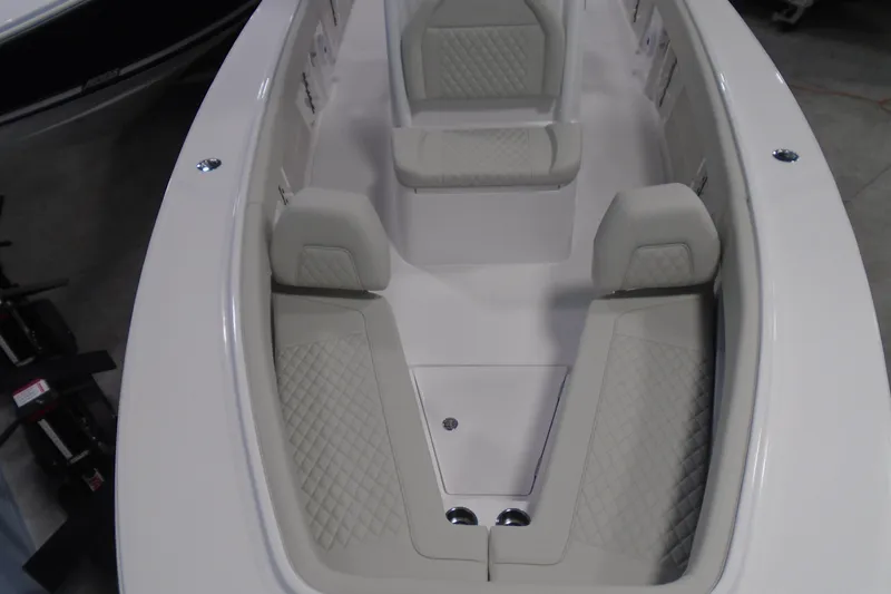 Slide: The Image of Luxurious seating area on a 2026 Jupiter 26 boat with quilted upholstery. - 25