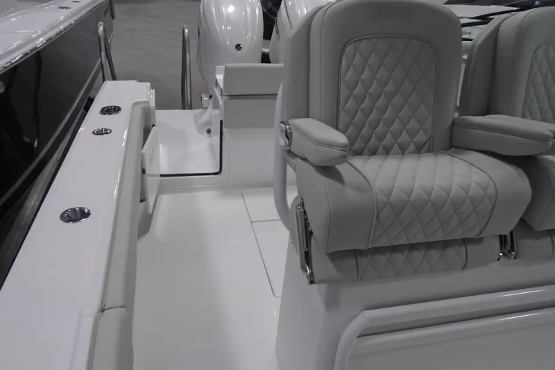 Slide: The Image of Luxurious seating on a 2026 Jupiter 26 boat, featuring quilted upholstery and sleek design. - 31