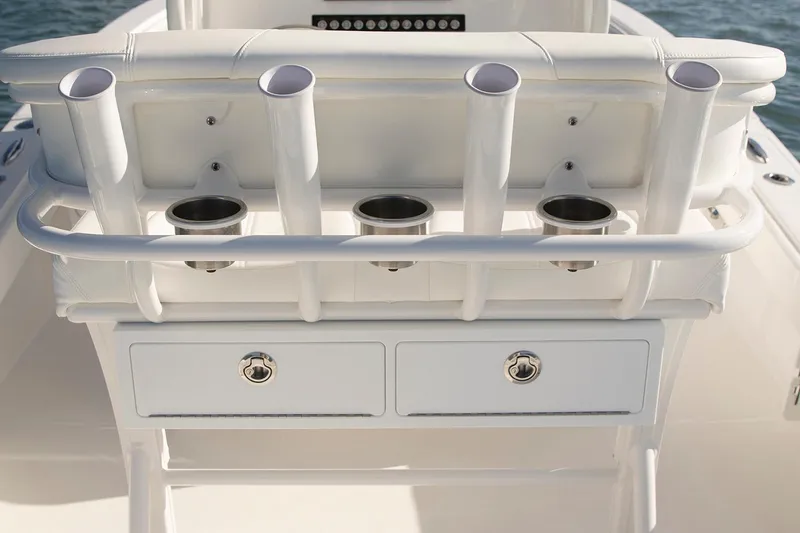 Slide: The Image of 2026 Regulator 24XO boat with sleek design and modern features, docked outdoors. - 7