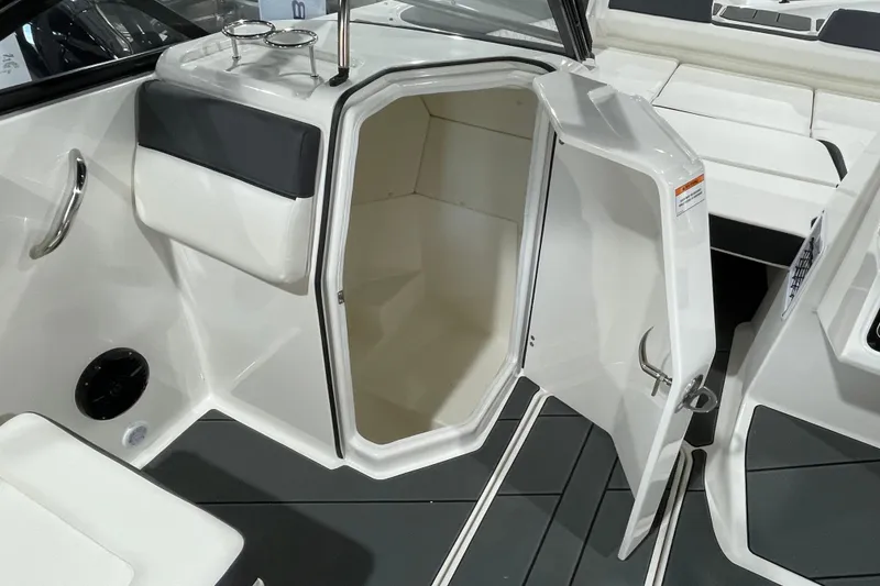 Slide: The Image of 2026 Bayliner D22I boat interior with open storage compartment and sleek design. - 12