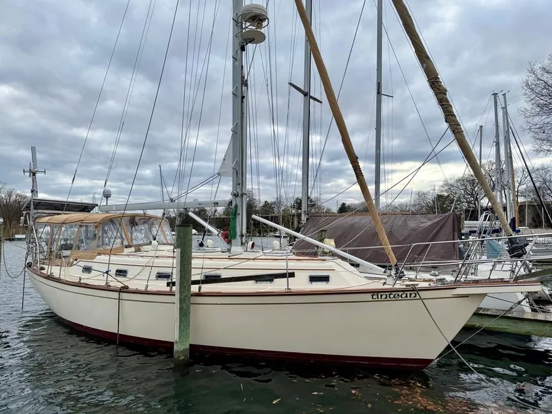 Slide: The Image of Island Packet 40 sailboat, 2000 model, docked on a cloudy day. - 0