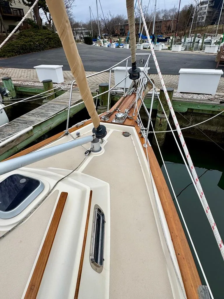 Slide: The Image of Island Packet 40 sailboat deck, 2000 model, docked at marina with visible rigging and fittings. - 2