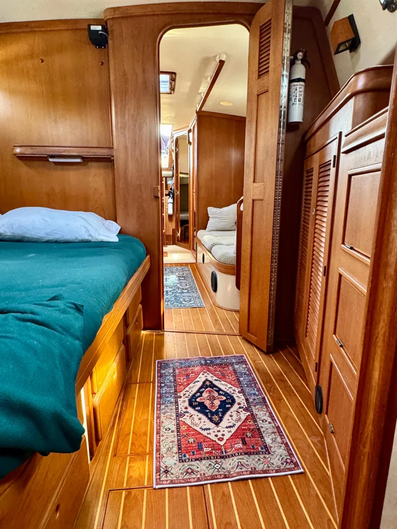 Slide: The Image of Interior of 2000 Island Packet 40 sailboat with wooden finish and cozy cabin layout. - 25