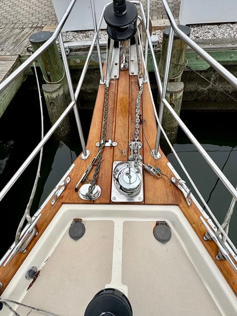 Slide: The Image of Bow of 2000 Island Packet 40 sailboat with anchor chain and deck fittings. - 3