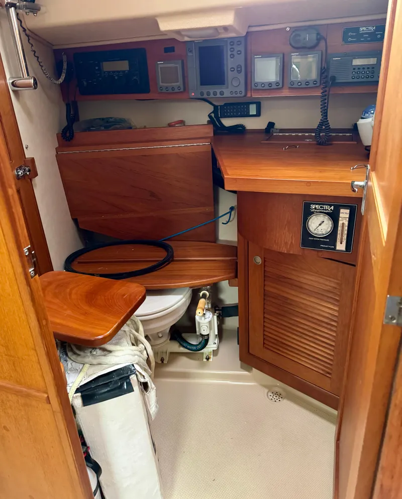 Slide: The Image of Island Packet 40 yacht interior with navigation equipment and wooden cabinetry, year 2000. - 35