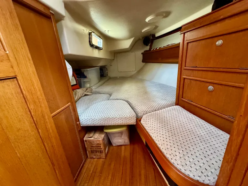 Slide: The Image of Cozy cabin interior of 2000 Island Packet 40 sailboat with wooden furnishings. - 37