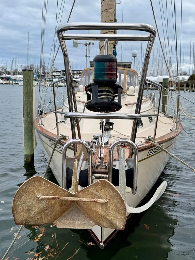 Slide: The Image of Island Packet 40 sailboat, 2000 model, docked in a marina with visible anchor. - 4