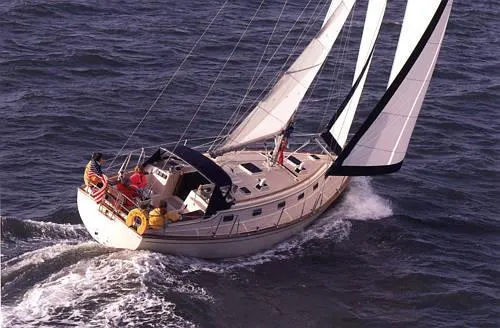 Slide: The Image of Sailing yacht Island Packet 40, 2000 model, navigating ocean waters with full sails. - 42