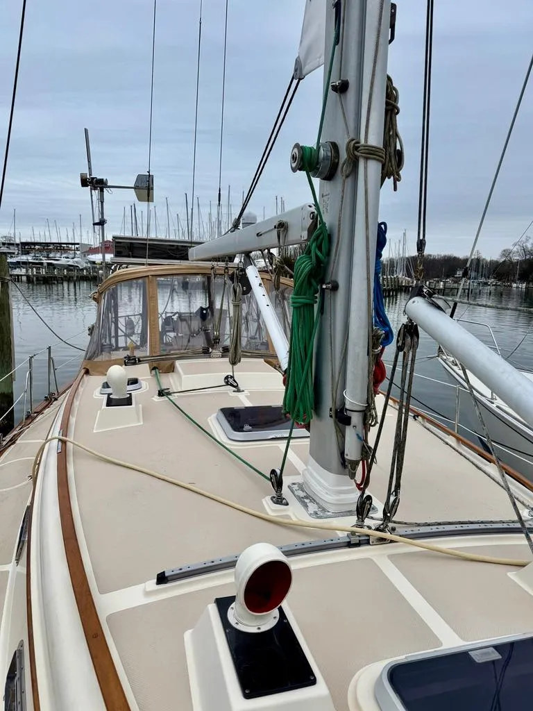 Slide: The Image of 2000 Island Packet 40 sailboat deck with rigging, docked at marina. - 5