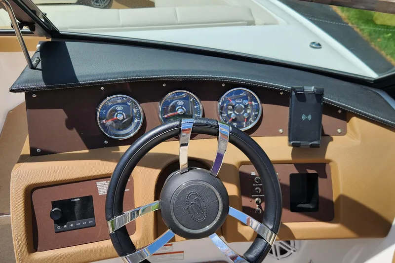 Slide: The Image of 2022 Cobalt CS22 boat dashboard with steering wheel and instrument panel. - 4
