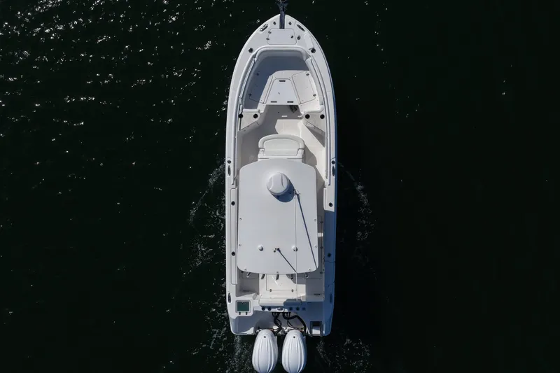 Slide: The Image of Aerial view of 2023 Edgewater 262CC boat cruising on dark water. - 15