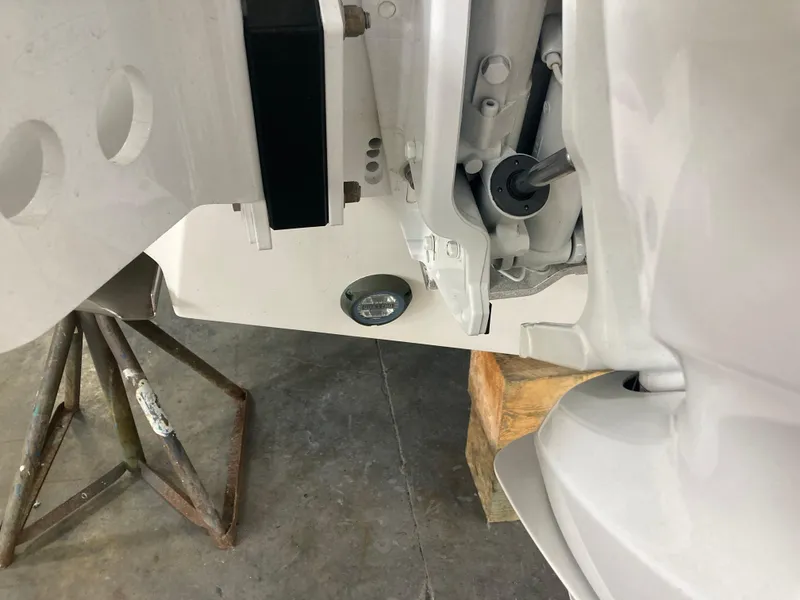 Slide: The Image of Close-up of 2023 Edgewater 262CC boat engine mount and transom. - 31